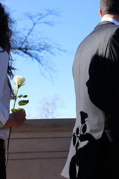 A shadow of a Remembrance scholar seen during the Rose Laying Ceremony on Friday.