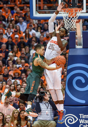 Rakeem Christmas defends against Miami's Angel Rodriguez on Saturday. On Monday against UNC, Christmas went for 22 and 12, but the lack of help he got down low doomed SU.