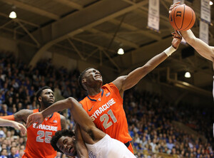 Tyler Roberson skies for a rebound during Saturday night's game against Duke. The Orange never came close in the second half, falling 73-54 to the Blue Devils at Cameron Indoor Stadium.