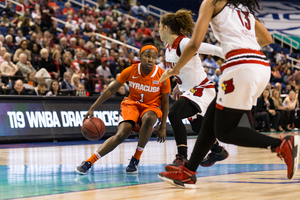 Alexis Peterson, the ACC's leading scorer, scored 31 points on Thursday night in SU's loss to Louisville. Above, she makes a move in Syracuse's ACC tournament victory against Louisville last March. 
