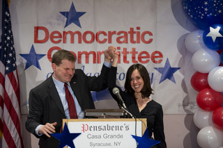 Dan Maffei celebrates with his wife, Abby, after seeing the results and his lead in the congressional race.