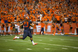 Gulley coasts into the end zone to finish his 65-yard rushing touchdown, the Orange's first score of the season.