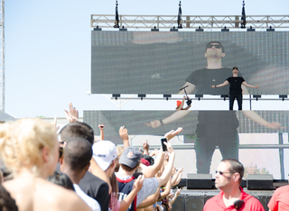 3LAU comes out on the main stage by standing on his DJ booth, raising his hands up to the sky. He played the fan favorite, 