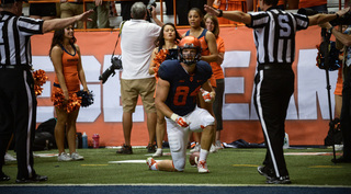 SU wide receiver Ben Lewis gets off the ground after failing to haul in a touchdown pass, one of three chances of his that didn't result in scores.