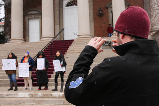 A student records rally-goers outside of Hendricks Chapel on Friday afternoon.