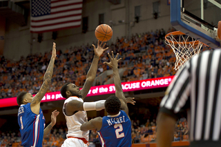 Christmas puts up a left-handed hook shot over Erik McCree during the first half.