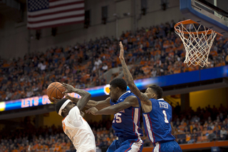 Sophomore forward B.J. Johnson goes up for a contested shot in the paint against two LT defenders.