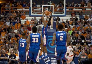 Louisiana Tech guard Alex Hamilton finishes off a dunk as Kaleb Joseph watches.