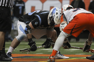 Syracuse's Ben Williams readies himself at the faceoff X. The sophomore faceoff specialist went 16-for-27 in faceoffs for the Orange.