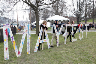 Syracuse University and SUNY-ESF students who attended Mayfest were encouraged to sign paint-splattered Mayfest letters, which were new this year.